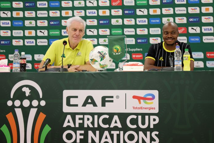 Coach Hugo Broos and Percy Tau
